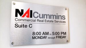 NAI Cummins Real Estate, Interior Door Signage, 2018.